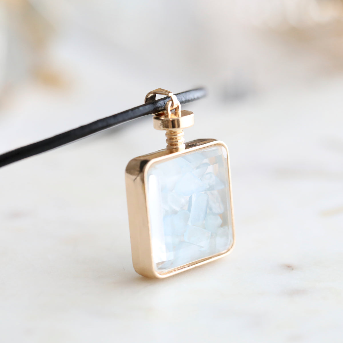 Close-up of Aquamarine Crystal Pendant Perfume Bottle Necklace – Italian Leather Cord with 18K Gold